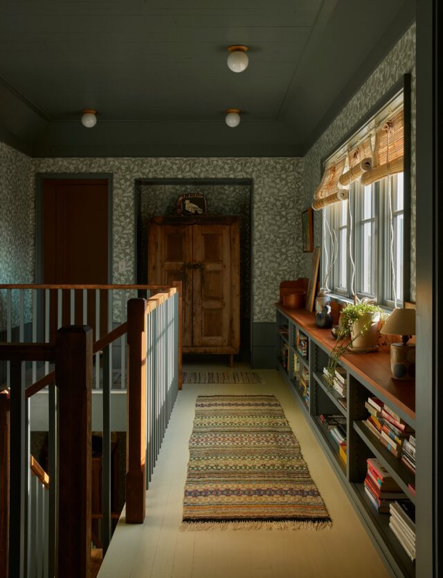 We’re back, and upstairs, at our Boulder farmhouse project! You may recognize the leafy @marthearmitageprints wallpaper from the entry on our first post, which we brought upstairs to tie the floors together.

We thought of the landing, which could have been a simple hallway, as a transit hub. It connects the ground floor with an office, the kids’ bedrooms and shared bath, and the primary suite. So, leaning into its nature as a kinetic space, we considered it as both an overlook and an intersection. In order to reduce congestion (and collisions), we created transitional spaces - short runways and anterooms - from the connected rooms.

We also designed the space to encourage interaction and an occasional slowing of pace. A low row of bookshelves provides a ledge for collecting curiosities, and we created a niche for a centrally located space for linens, stored within a vintage cabinet we found at @nickeykehoe. The office also has two operable interior windows (one is in the door) for cross ventilation, letting more light into the landing, and hollering down to new arrivals or those on their way out.

The door to the aforementioned laundry chute lives in a sunny anteroom connecting two bedrooms and their shared bathroom. Each bedroom has its own two-toned palette - the one we didn’t photograph features two tones of green.

The wood flooring on this level was left unprotected during most of construction - a suggestion floated to us by our foreman Jim as he continued to sink into the aged look we were trying to achieve. We knew they were going to be painted (except in the kids’ rooms), so it made good sense and got us a jump start on some good dings and gouges. This kind of symbiotic collaboration was a significant part of what made working on this project so damn fun and rewarding.

The link to the feature is in our bio! 🏔️

Interior Architecture & Design: @landedinteriors #landedinteriors
Project Team: @heathermenegat, @rebeccamullerdesigns, Tiffany Kim, Luna Sibai, Laura Marx, Hanna Dooley
Architecture & Construction: @coburnpartners 
Landscape: @treeoflifelandscaping 
Photography: @yoshihiromakino 
Styling: @rainakattelson 
Publication: @archdigest