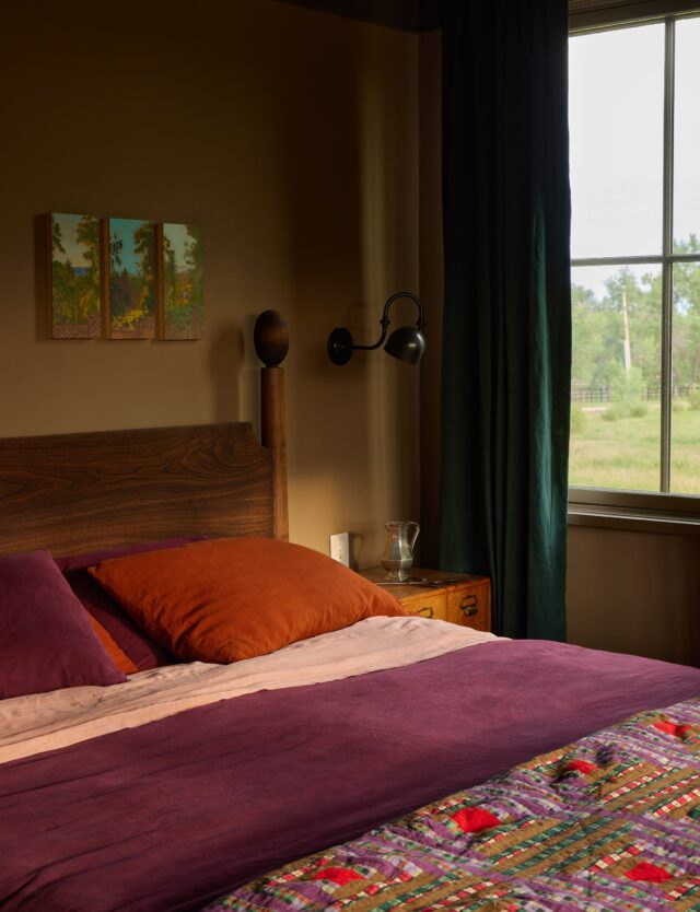 We’re in the primary suite, and the final area of the main house before we move over to the cabin. We wanted these spaces to feel cohesive and a little set apart from the rest of the home, with the hall providing a soft barrier for people getting ready at different hours of the morning.

In the spirit of cohesion, we bridged three of the rooms with paintings from our friend @iamdrewbennett. Drew’s art studies, amongst other things, observation. How and where are we building awareness and focusing our attention? What makes connection feel embodied? Intellectual? The mindset his work puts us in felt like a worthy companion for beginning and closing a day.

The yellow hallway is covered in a @williammorriscollection wallpaper that feels both cheerful and embracing. This sensation is emphasized by a krokbragd rug we had woven in a custom size by @topole.rugs. If you have not seen one of these rugs before, they are thick and homey - like a sweater for your feet - and a real treat to walk on.

The bath is broken into several chambers, with the largest at the end enclosing a clawfoot tub and a custom vanity made for us by @petersen_antiques. The steam shower features one of the more elaborate shower mosaics in the home, inspired by Scandinavian folk embroidery. In the water closet, a favorite wallpaper scene of ours from @marthearmitageprints provides…an optional place to focus your attention.

We have been told that the bedroom is like a sleeping pill - there is something about the deep, chocolatey tones that is de-stimulating and restful, and they also allow the incredible views to spring into the room. A statuesque walnut bed from @bcmtco creates an elegant gravity, and we infused deep, earthy jewel tones that would harmonize with the room.

Enjoy your weekends everyone, we’ll see you next week.

The link to the feature is in our bio! 🏔️

Interior Architecture & Design: @landedinteriors #landedinteriors
Project Team: @heathermenegat, @rebeccamullerdesigns, Tiffany Kim, Luna Sibai, Laura Marx, Hanna Dooley
Architecture & Construction: @coburnpartners 
Landscape: @treeoflifelandscaping 
Photography: @yoshihiromakino 
Styling: @rainakattelson 
Publication: @archdigest